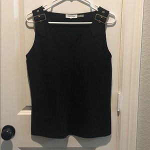 V-neck black shirt with gold buckle detail